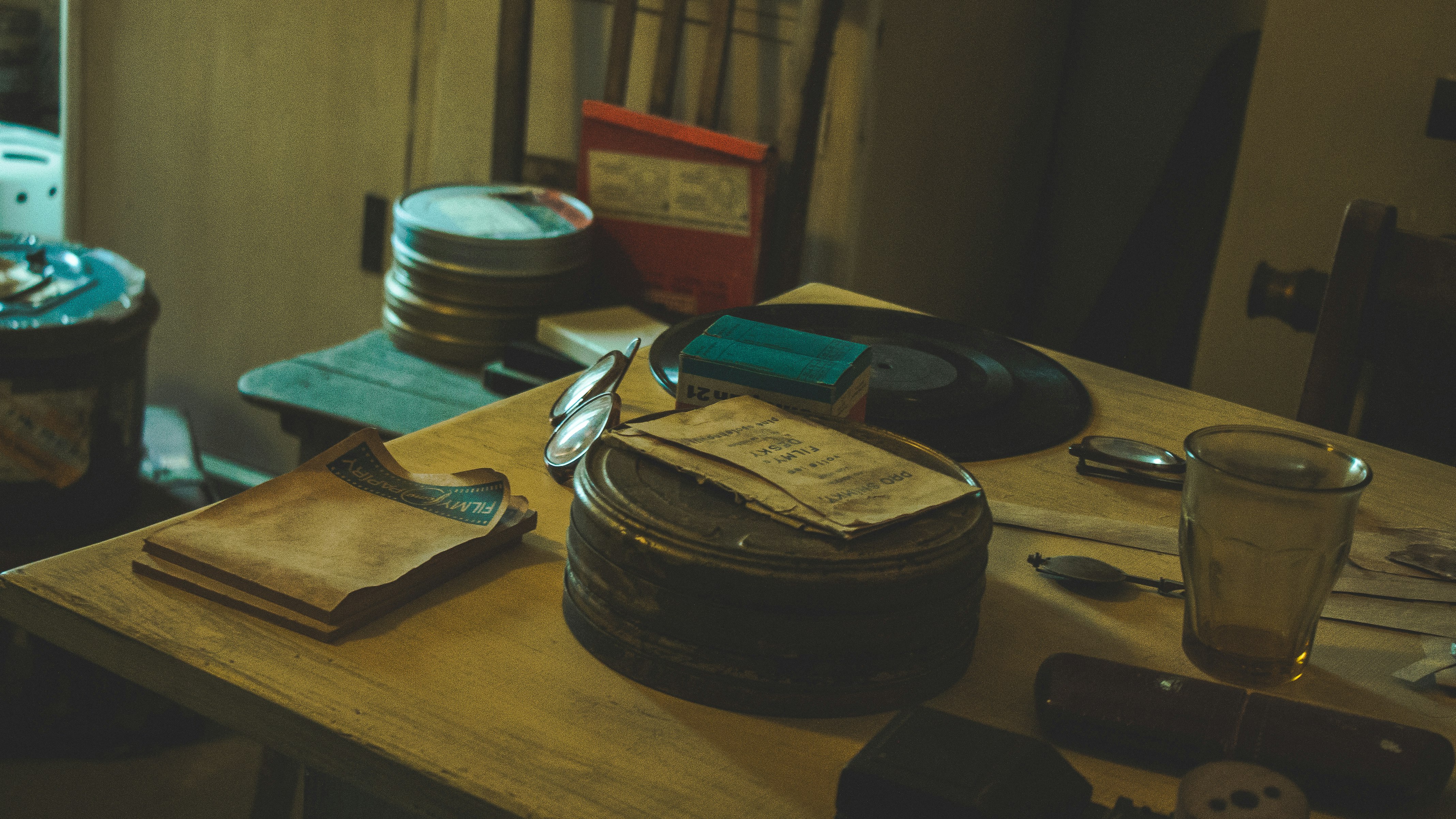 black round container on brown wooden table